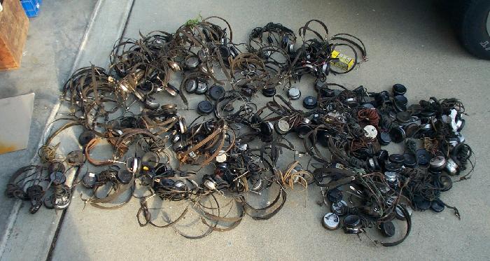 large pile of headphones